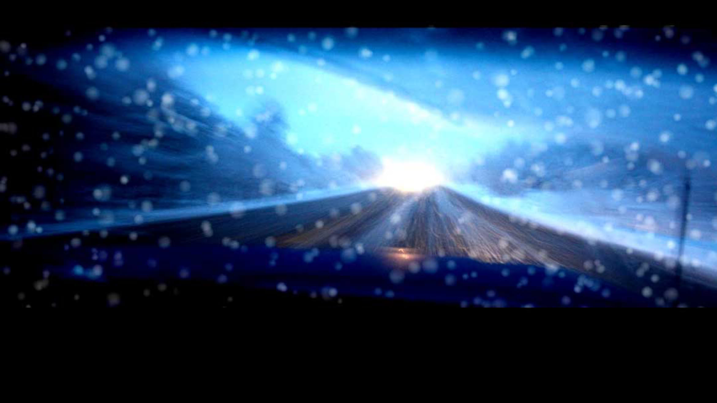 Header photo of From Reno to Truckee, an out of focus road at night in the rain